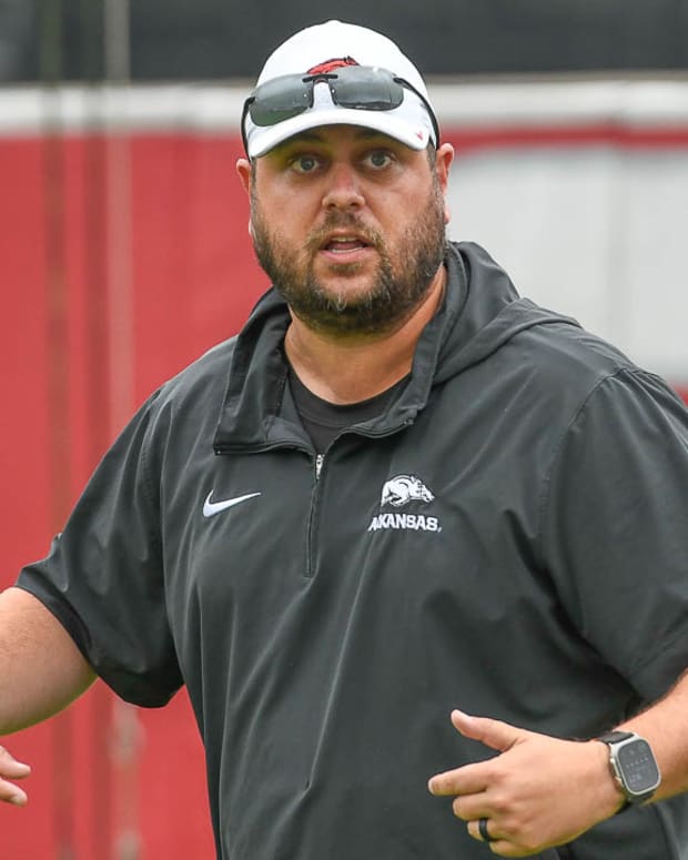 Razorbacks tight ends coach Morgan Turner after Monday morning's practice